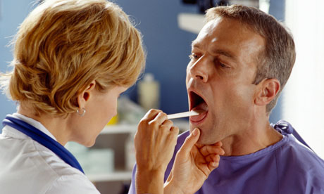 Doctor Examining Patient's Throat